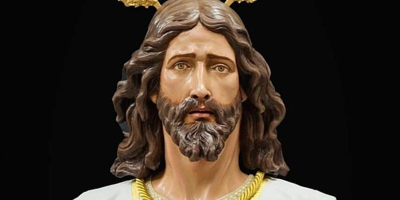 El Sant&iacute;simo Cristo de la Fe y la Salud procesiona por la zona del Retiro en el Domingo de Ramos